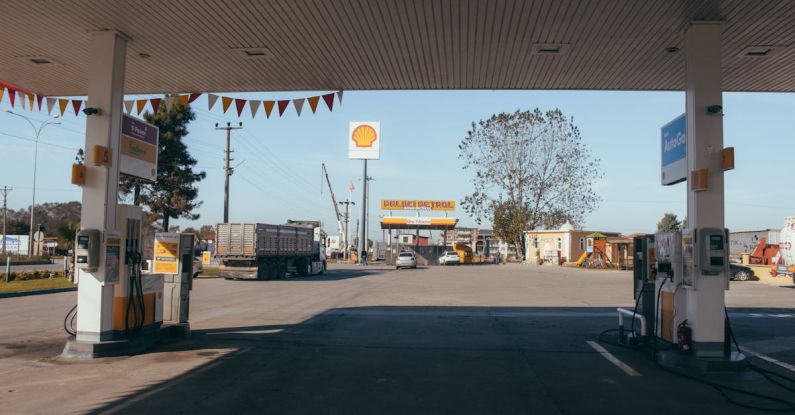 Energy Costs - Empty gas station with oil petrol dispensers located on highway for serving long distance vehicles