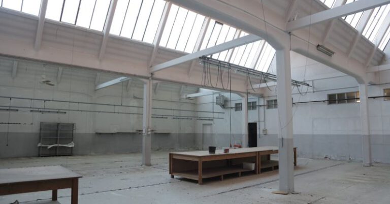 Support Structures - Bright premise for storage with concrete floor and metal beams inside modern industrial building