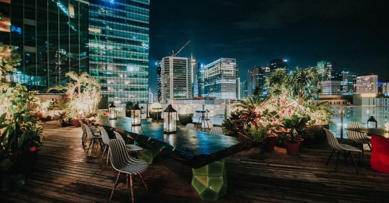 Rooftop Garden - View Of The Cityscape From A Rooftop Garden Restaurant At Night
